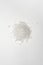 Sea salt granules loose on a white background