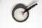 Sea salt granules in a small bowl with a bone spoon