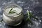 Sea salt scented herb rosemary on black stone background