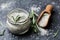 Sea salt scented herb rosemary on black stone background