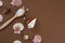 sea salt spoon and sea shells brown background copy space