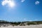 Sea sand dune. Sea coast. Deserted seashore. Bright sun in the sky