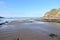 Sea scape of a deserted beach when the tide has not long gone out.