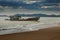 Sea scape of wreck boat on beach