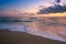 Sea scenery at sunset. beautiful landscape of sandy beach in purple dusk. wave running on to the shore