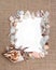 Sea shell border on burlap texture