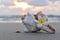 SEA SHELL AND PLUMERIA FLOWER AT SUNSET 