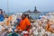 Sea shell seller with background view of Vivekananda Memorial Rock, in Kanyakumari, Tamilnadu