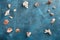 Sea shells on blue wooden background