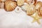 Sea shells and star close up on sand background with copy space. Natural summer background with fine white sand.