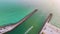 Sea shore inlet with white yachts sailing on colorful waves. North and South Jetty on Nokomis beach near Venice, Florida