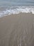 Sea shore,sand,foam and waves