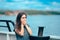 Sea sick woman suffering motion sickness while on boat