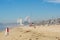 Sea spray and fog with industrial smog shrouds Californian beach