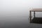 Sea, stairs, pier and foggy day