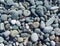 Sea stones background. Gray sea coastal pebbles