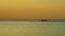 Sea sunset fishing boat red sunset on water surface of sea