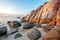 Sea sunset rocks beach on blue sky background. Beauty evening sunrise. Blue background.