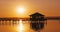 Sea sunset or sunrise and old wooden fishing jetty pier, calm nature landscape in 4K video. Travel destination.