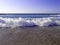 Sea surf. Powerful waves. A foaming wave rolls ashore. Storm at sea. Selective focus, shallow depth of field