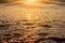 Sea surf on sunset time. Black Sea coast. Pebble washed by sea waves