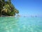 Sea surface with turquoise water and island shore