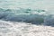 Sea tide splashes, turbulent clear water closeup