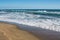 Sea tide waves on sand beach