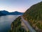 Sea to Sky Highway on West Coast of Pacific Ocean. Aerial Mountain Landscape. Twilight sky.