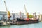 Sea Trade Port. Container terminal. Cranes, cargo ships. Horizon