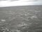 Sea of Troubles with the ship`s deck. Waves in cloudy weather