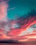 Sea under a cloudy sky during a breathtaking colorful sunset - perfect for wallpapers