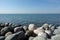 Sea view. Pebble beach with large stones