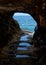 Sea view through the rock hole near Megalo Livadi on Serifos island in Greece