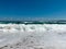 Sea view with seagulls and wave crashing to the shore