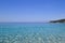 Sea view. Transparent water and calm turquoise sea with sun highlights