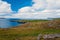 Sea view under cloudy sky from hilly coast in Torshavn, Denmark. Beautiful landscape view. Beauty of nature. Wild sea