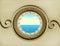 Sea in vintage metallic porthole