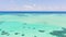 Sea water with lagoon and reefs, water background. Seascape with clear water