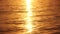 Sea water surface sunset. Low angle view over golden sea water. Sun glare. Abstract nautical summer ocean nature