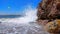 Sea wave is breaking on beach stones