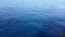 Sea wave close up, surface of the water on a bright day, marine background photo bright blue transparent water .