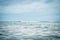 Sea wave horizon turquoise water blue dramatic overcast sky landscape surfing lifestyle