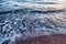 Sea wave and pebble shore close-up, abstract natural background