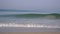 Sea wave, slow motion. Ocean coast, sandy beach, surf in the early morning