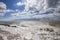 Sea wave surf. Sea waves with a lot of sea foam. In the foreground on a pebble beach. The element of water, excitement, bad weathe