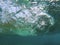 Sea wave swirl underwater photo. Water surface below waterline. Seawater banner template. Blue green marine abstraction