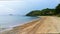 Sea waves on the beach, mountain and sky