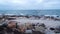 Sea waves break on the rocky stones on the beach. Seascape, storm view from the shore. Cloudy day. HD video