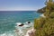 Sea waves crashing onto rocks with water splashes. Corfu island, Greece